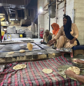 Women preparing naan bread in the langar
